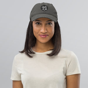 AG - Woman wearing a gray cap with on a plain background