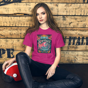 AG - Woman wearing a berry t-shirt with, stronger than you realize, graphic design sitting against a wooden wall.