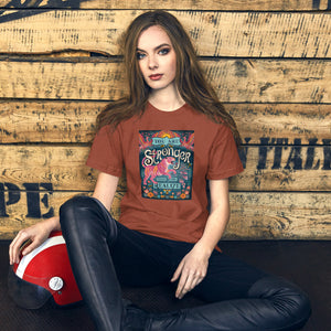 AG - Woman wearing a heather clay t-shirt with, stronger than you realize, graphic design sitting against a wooden wall.