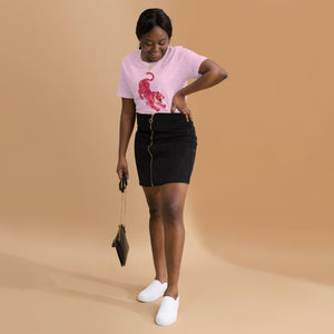 AG - Woman wearing a heather prism t-shirt, with a tiger graphic design, on a beige background