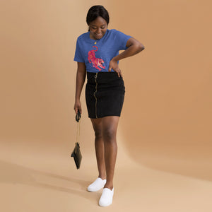 AG - Woman wearing a heather true royal t-shirt, with a tiger graphic design, on a beige background