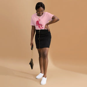 AG - Woman wearing a pink t-shirt, with a tiger graphic design, on a beige background